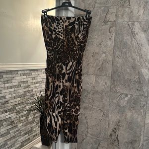 Used size small woman’s leopard print romper with pockets